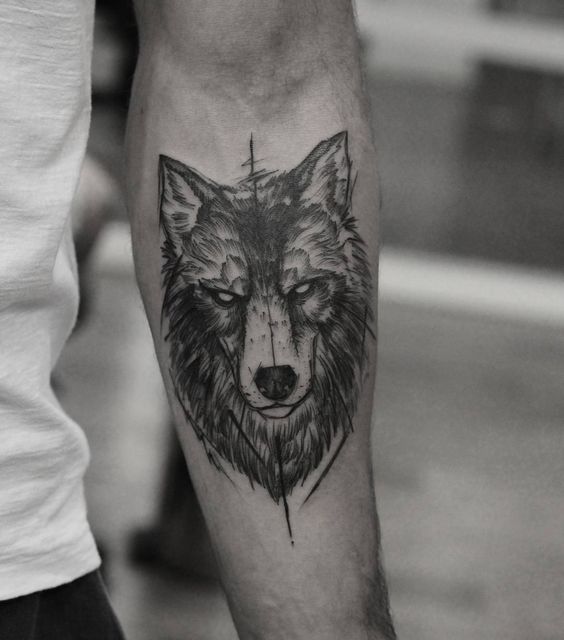 Tattoo of a wolf on the forearm for men