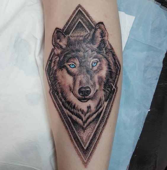 Tattoo of a wolf on the forearm for men