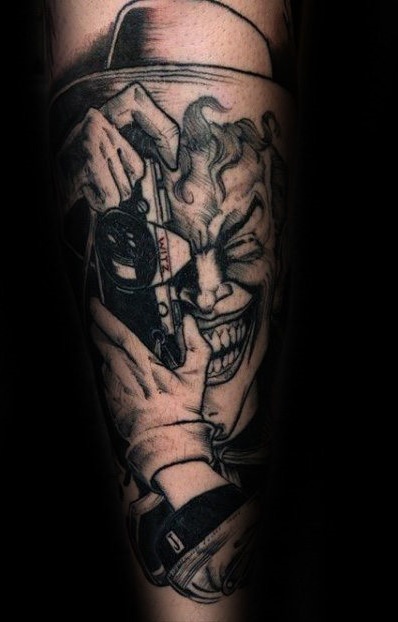 Joker tattoo on the arm