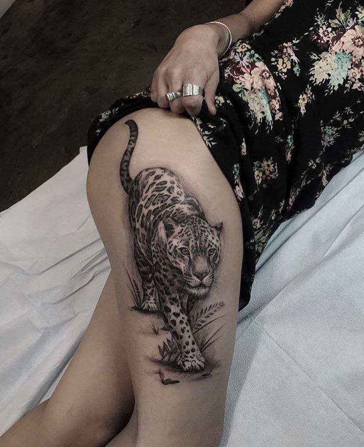 Leopard tattoo on the hip for women