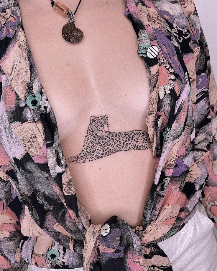 Leopard tattoo on the chest for women