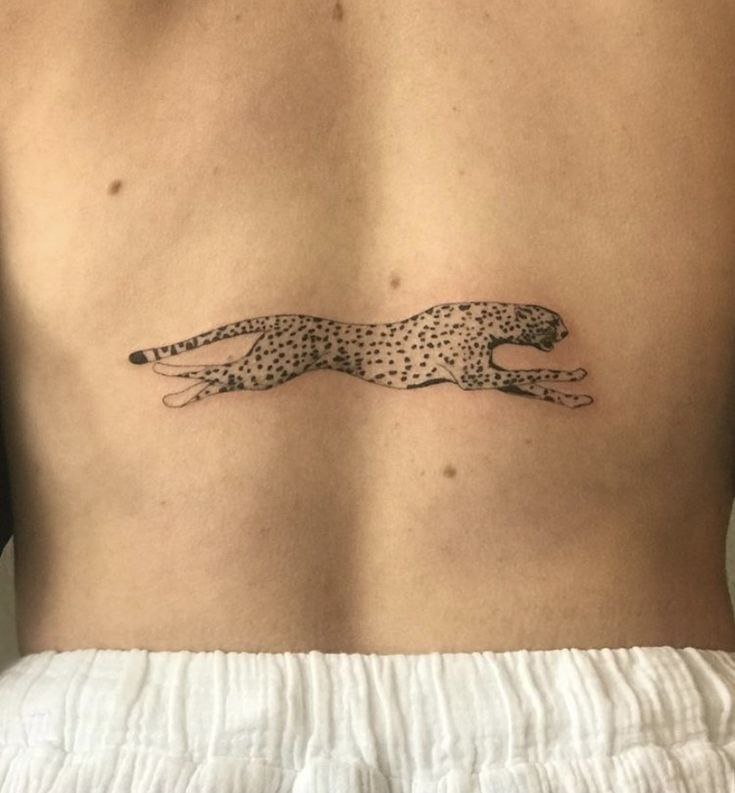 Cheetah tattoo on the back for women