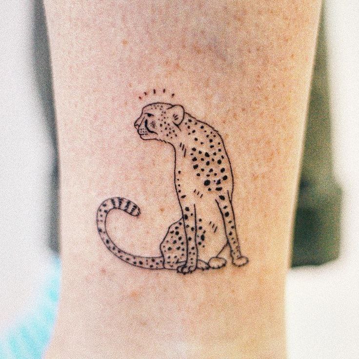 Cheetah tattoo on the leg