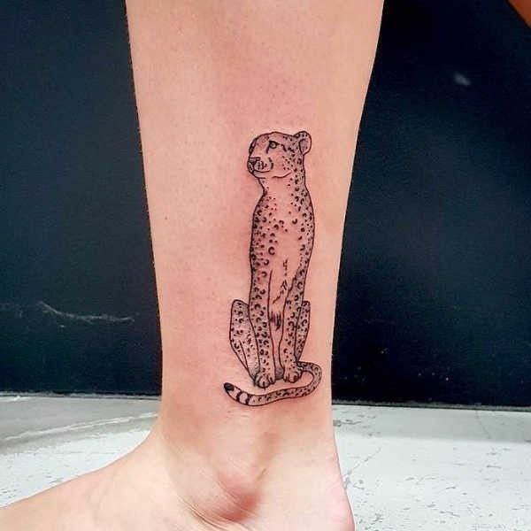 Cheetah tattoo on the leg for women