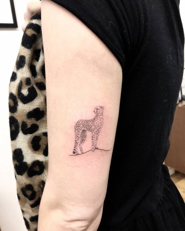 Cheetah tattoo on the shoulder for women