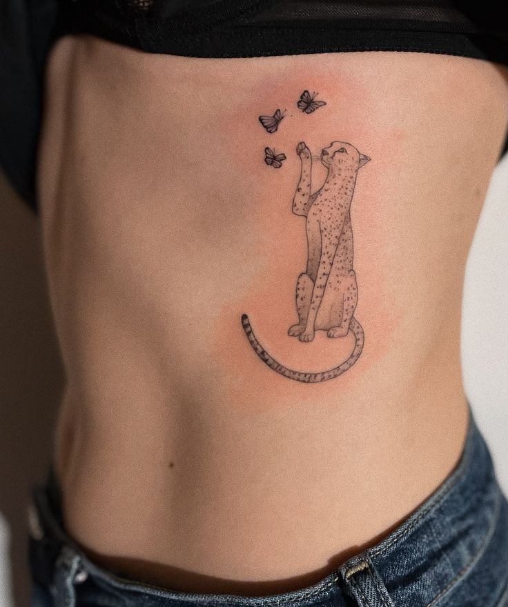 Cheetah tattoo on the side for women