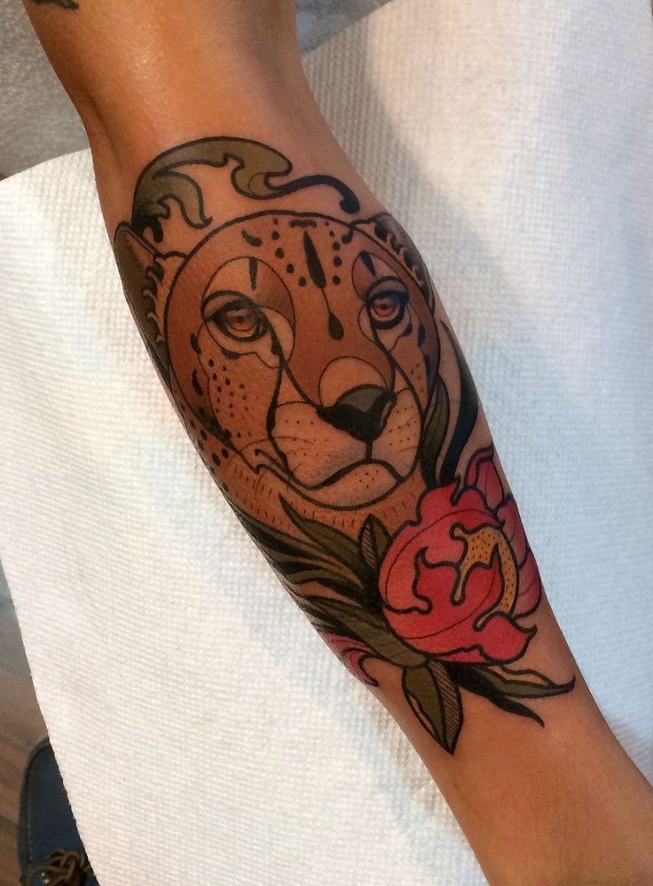 Cheetah tattoo on forearm for women