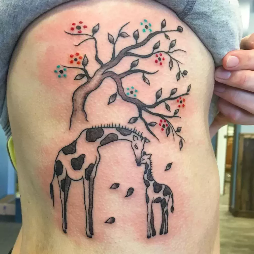 Tattoo of a giraffe on the side for women