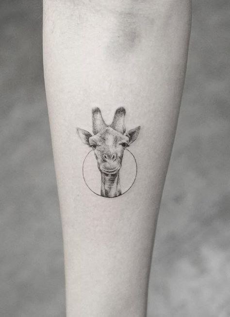 Tattoo of a giraffe on the forearm for women