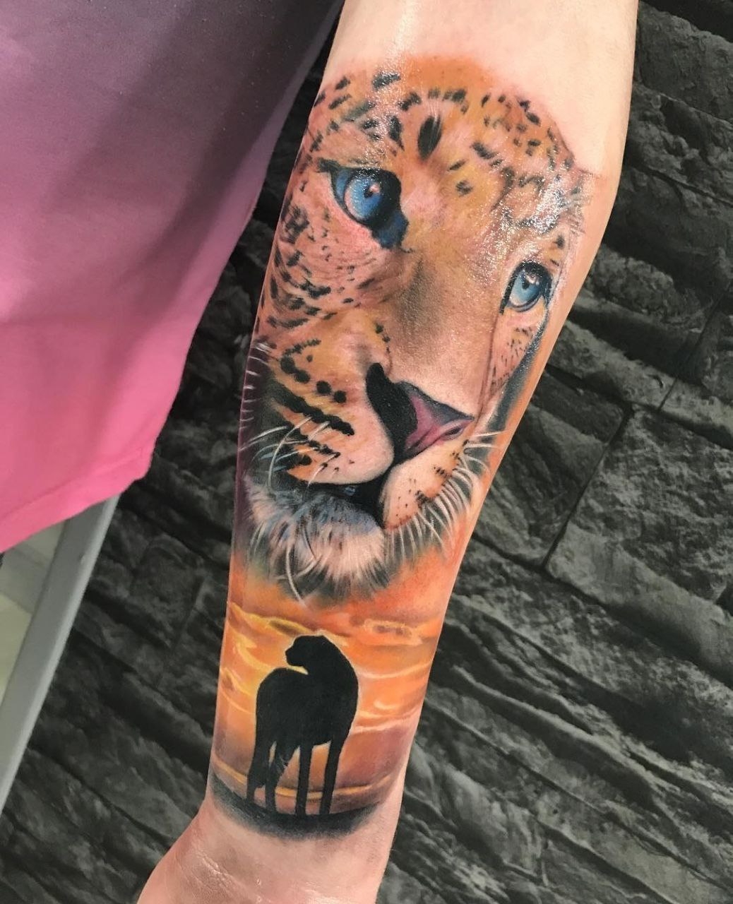 Leopard tattoo on the forearm for men