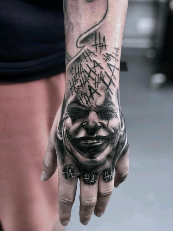 Joker tattoo on the wrist