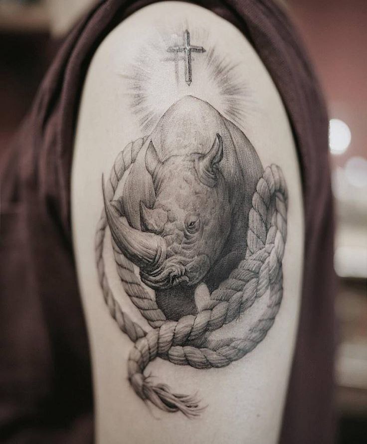 Rhinoceros tattoo on the shoulder for men