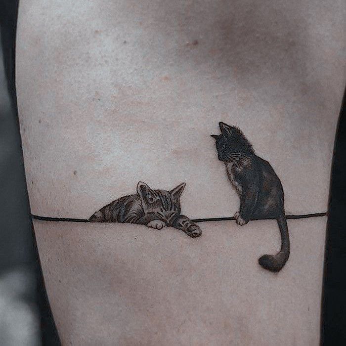 Cat tattoo on the side for women