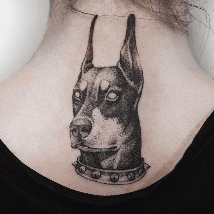 Doberman tattoo on the back for women