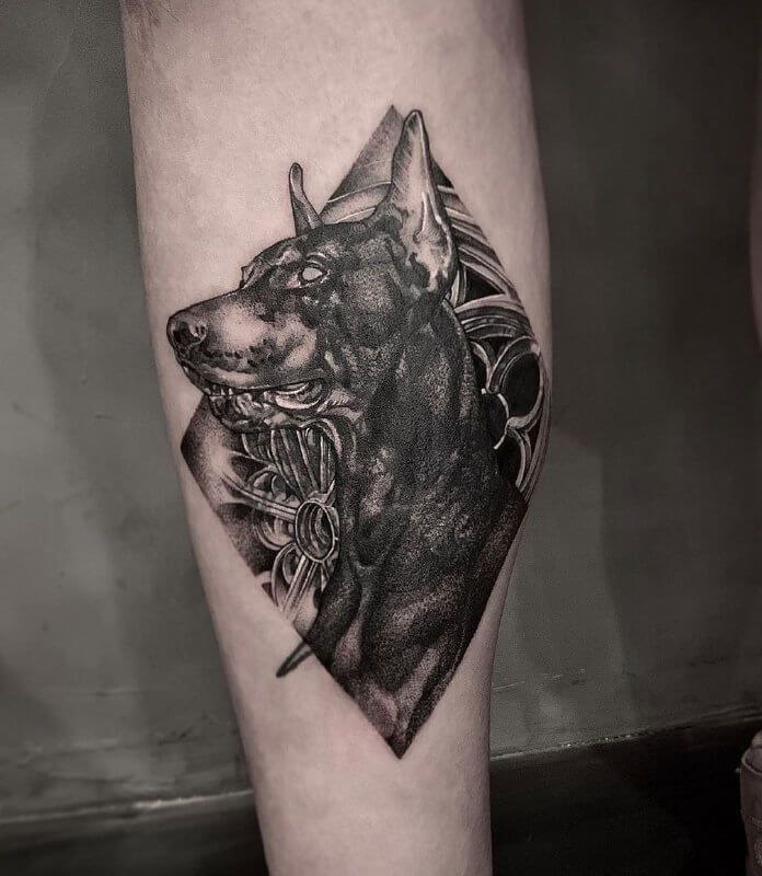 Doberman tattoo on the shin for men