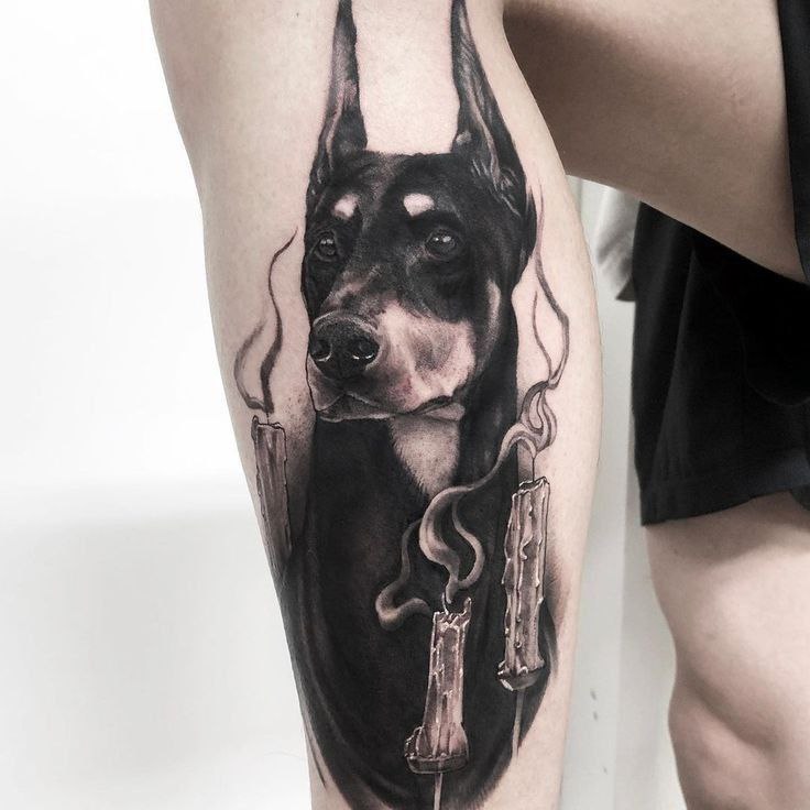 Doberman tattoo on the shin for women