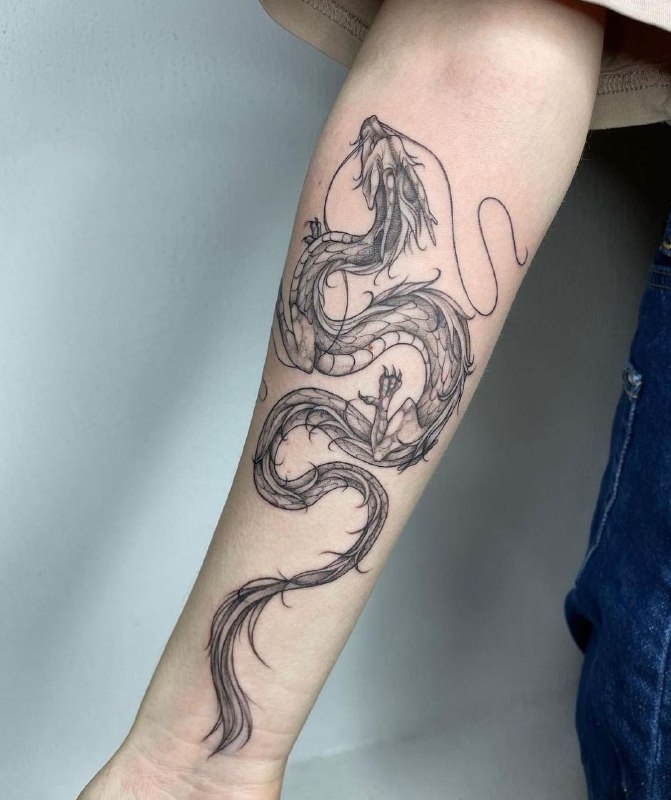 Dragon tattoo on the forearm for women