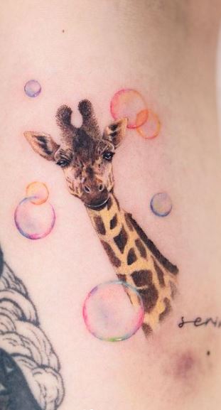 Giraffe tattoo on the belly