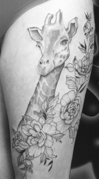 Giraffe tattoo on the thigh for women