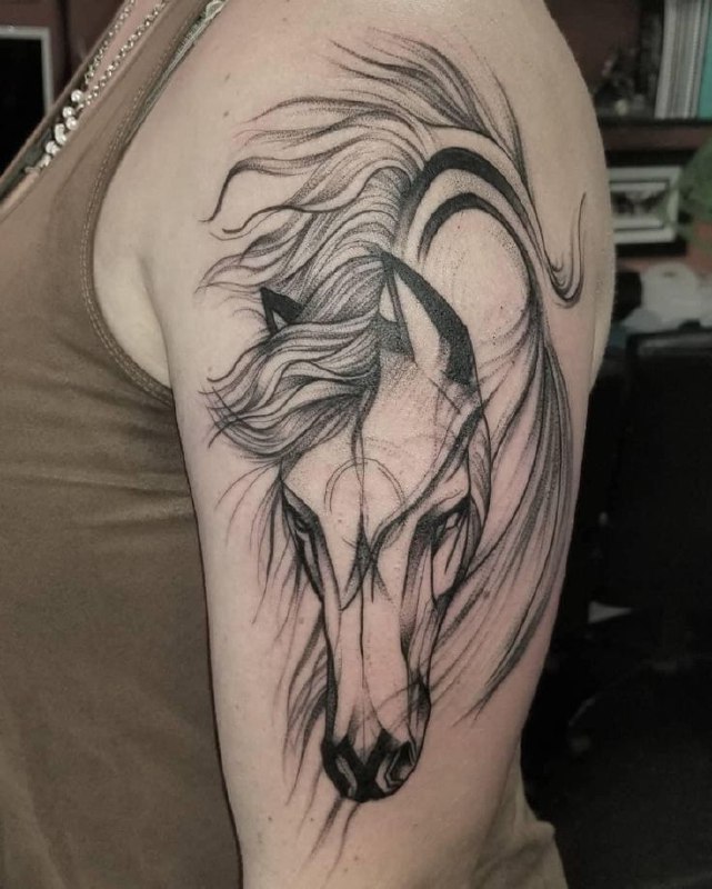 Tattoo of a horse on the shoulder for men