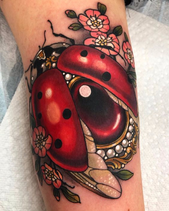 Ladybug tattoo on the arm