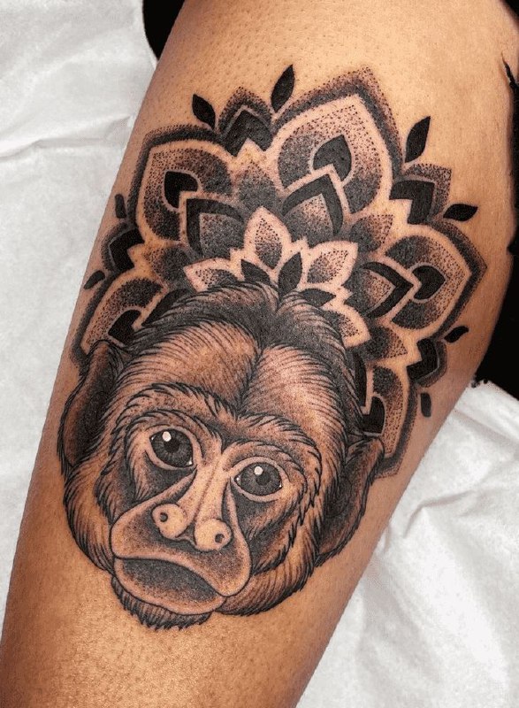 Monkey tattoo on the hip for men