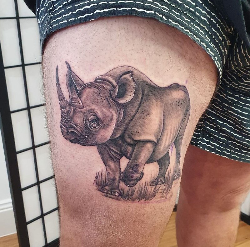 Rhinoceros tattoo: a symbol of strength, resilience and protection