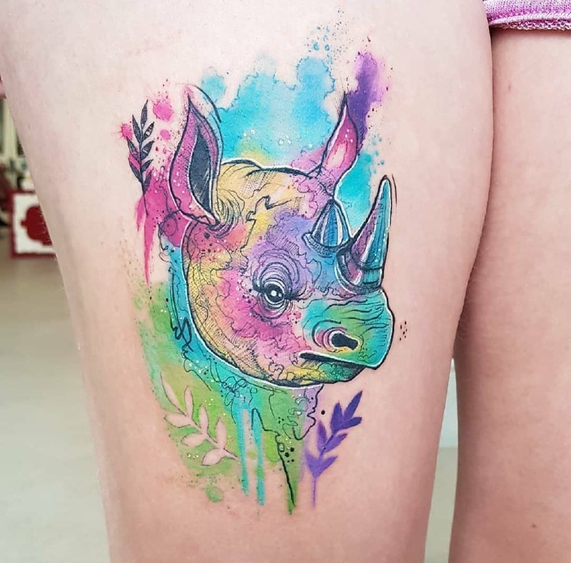 Rhinoceros tattoo on the hip for women