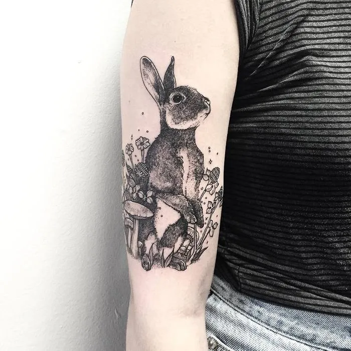 Tattoo of a hare (rabbit) on the shoulder for women