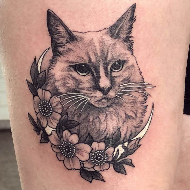 Cat tattoo on the leg