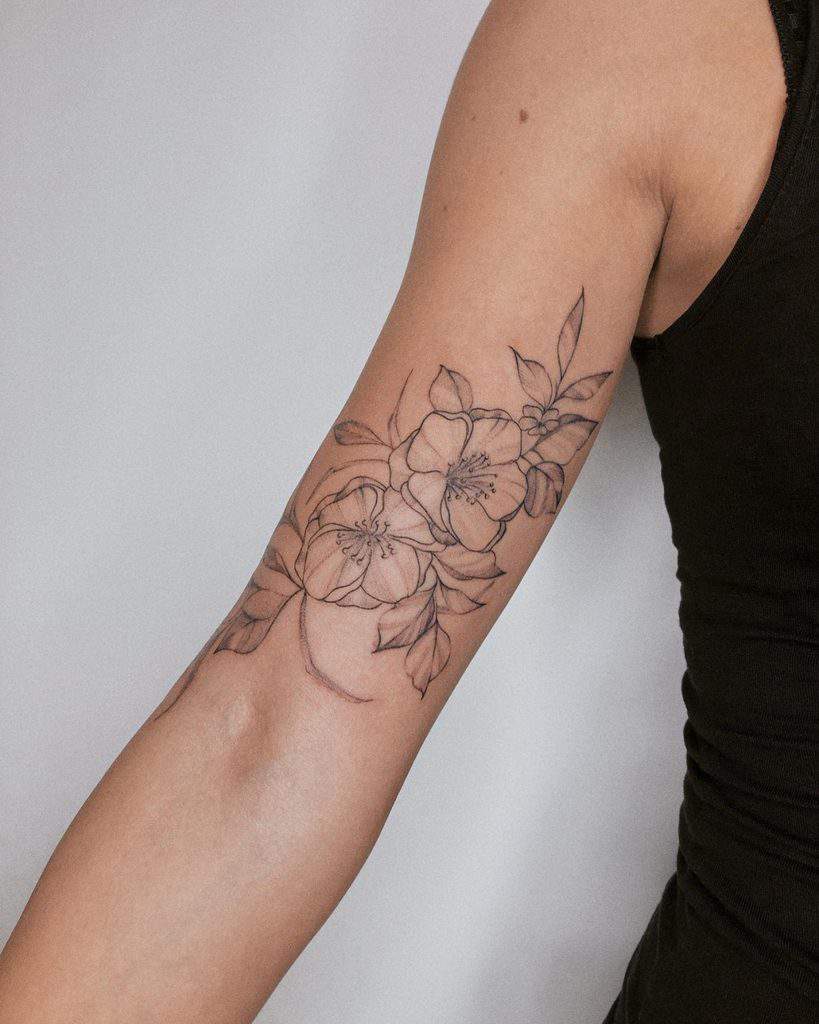 Jasmine tattoo on the shoulder for women