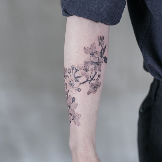 Jasmine tattoo on the forearm for men