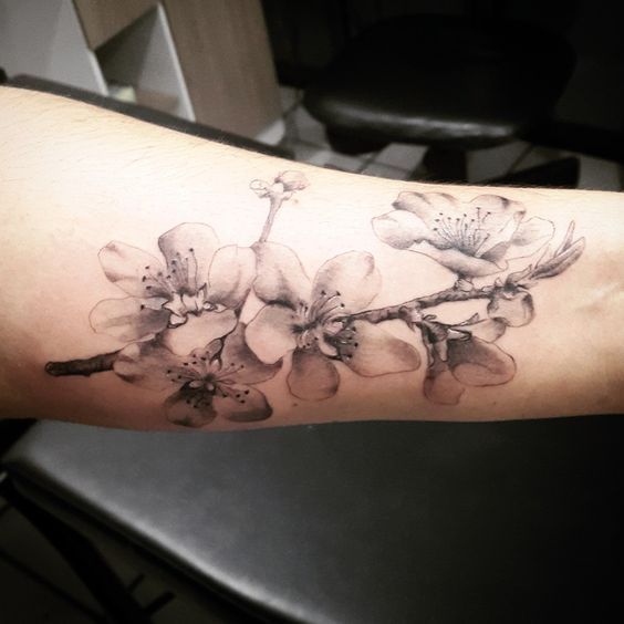 Jasmine tattoo on the forearm for men