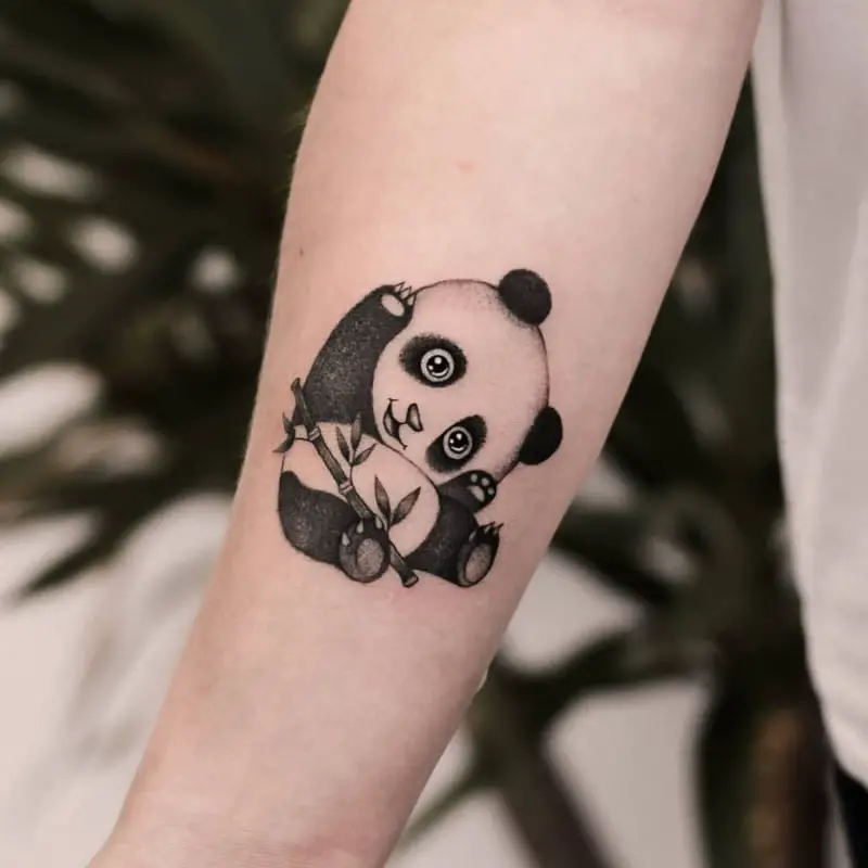 Panda tattoo on forearm for women