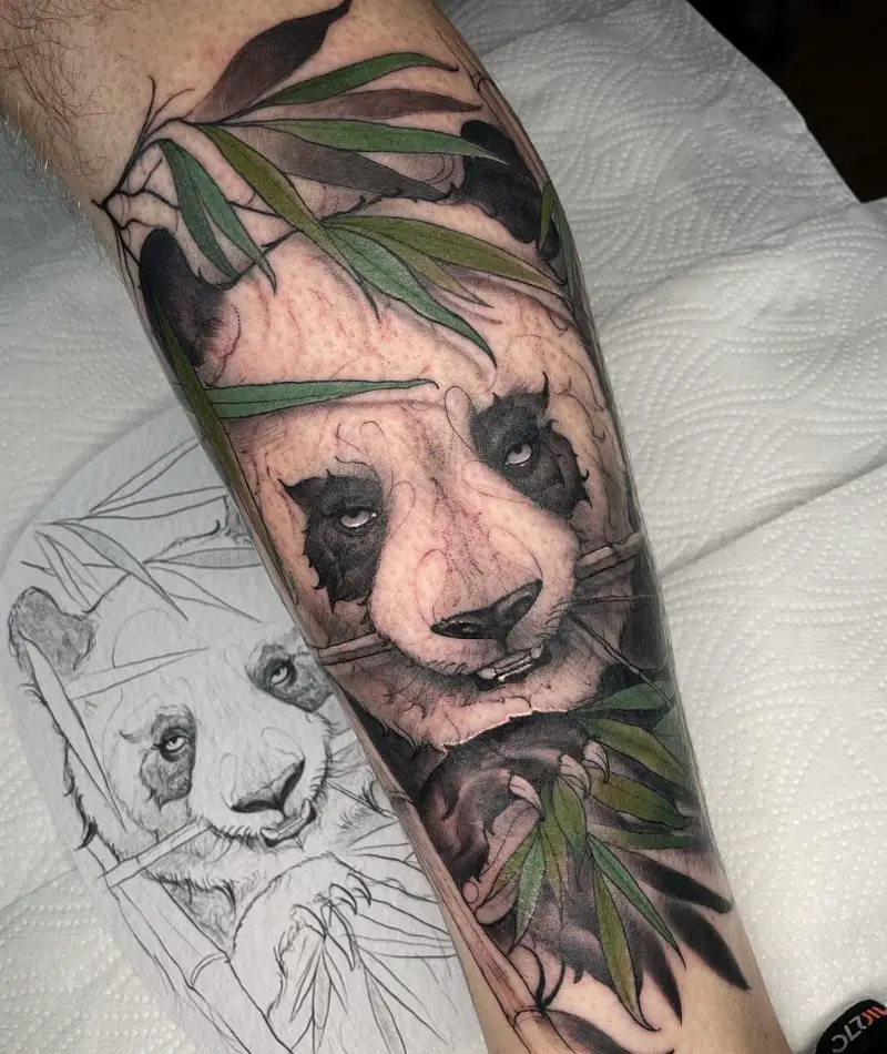 Colored panda tattoo on the forearm for men