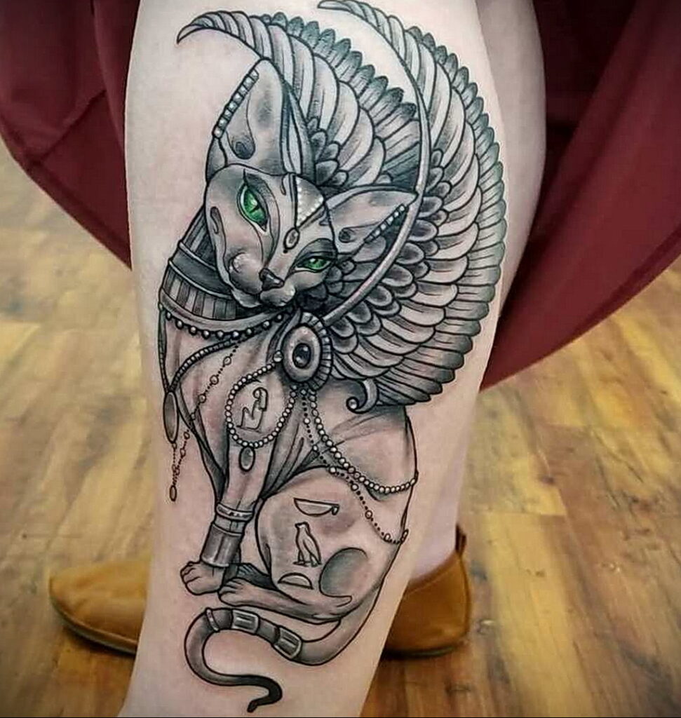 Tattoo of a sphinx on the lower leg for women