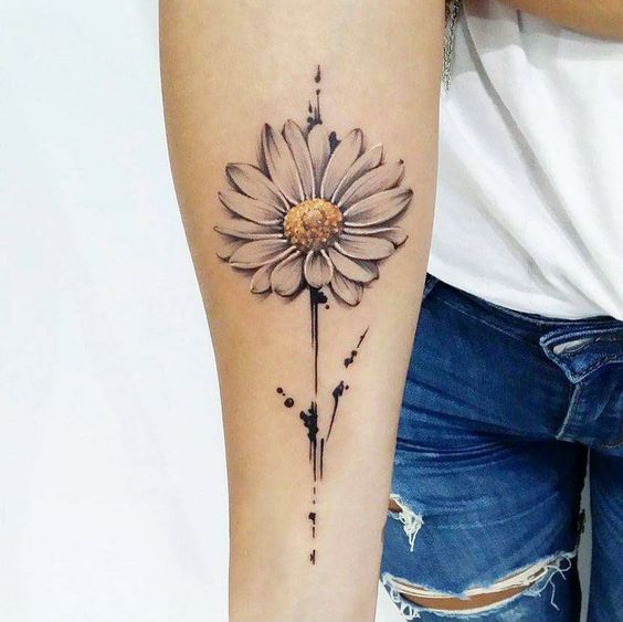 Colorful daisy tattoo on the forearm for women