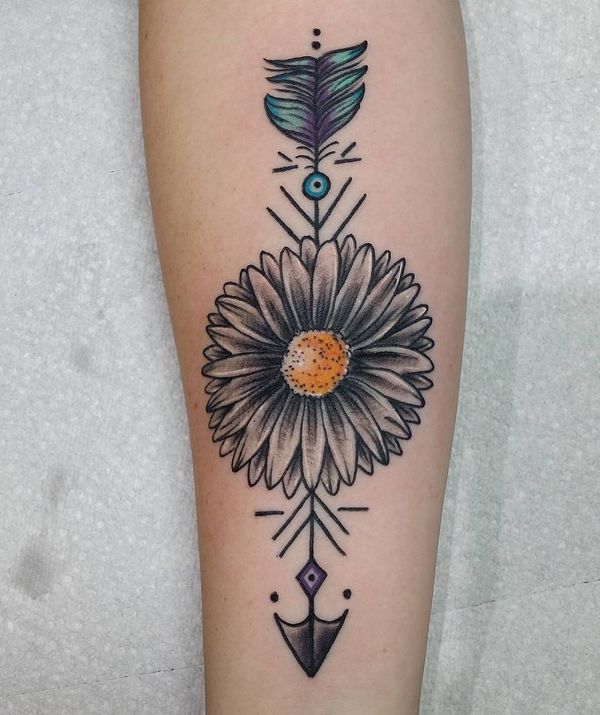 Colorful daisy tattoo with arrow on forearm for women