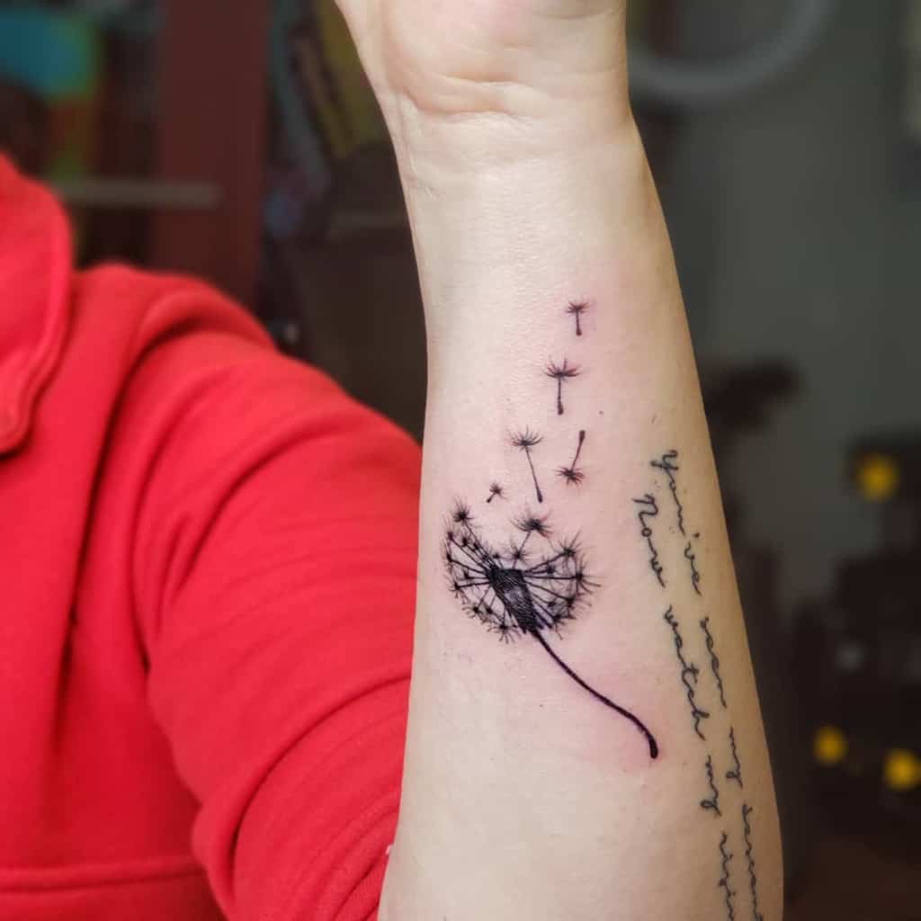 Dandelion tattoo on forearm for women