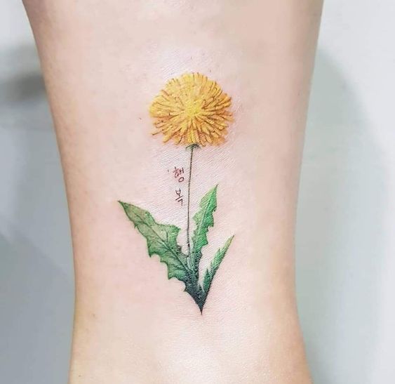 Colorful dandelion tattoo on the leg for women