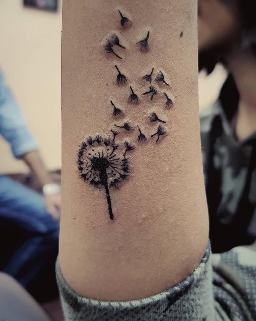 Dandelion tattoo on forearm for women