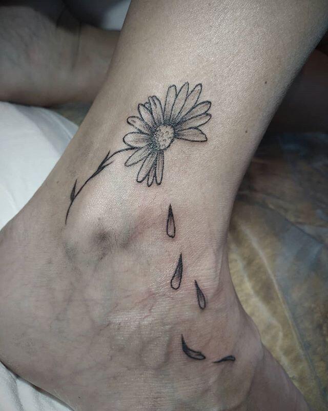 Ankle daisy tattoo for women