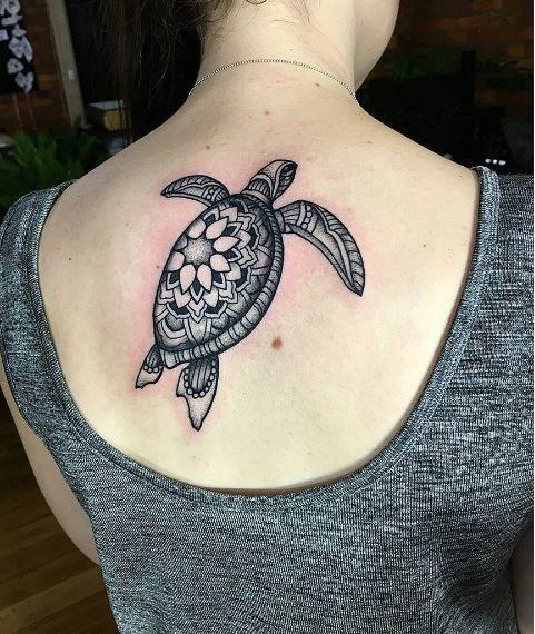 Turtle tattoo on the back for women