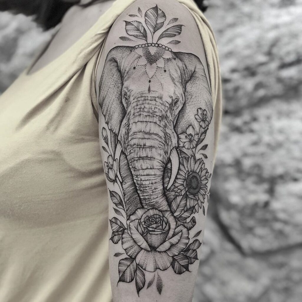 Elephant tattoo on the shoulder for women