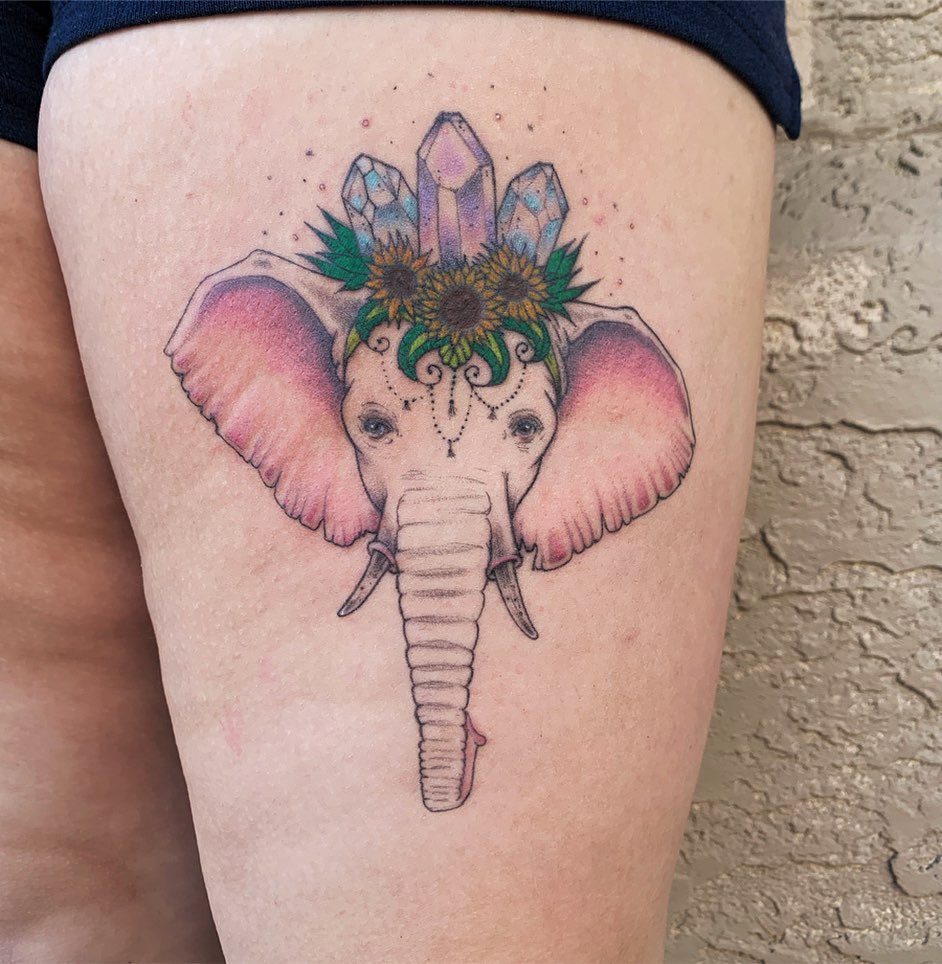 Elephant tattoo on the hip for women