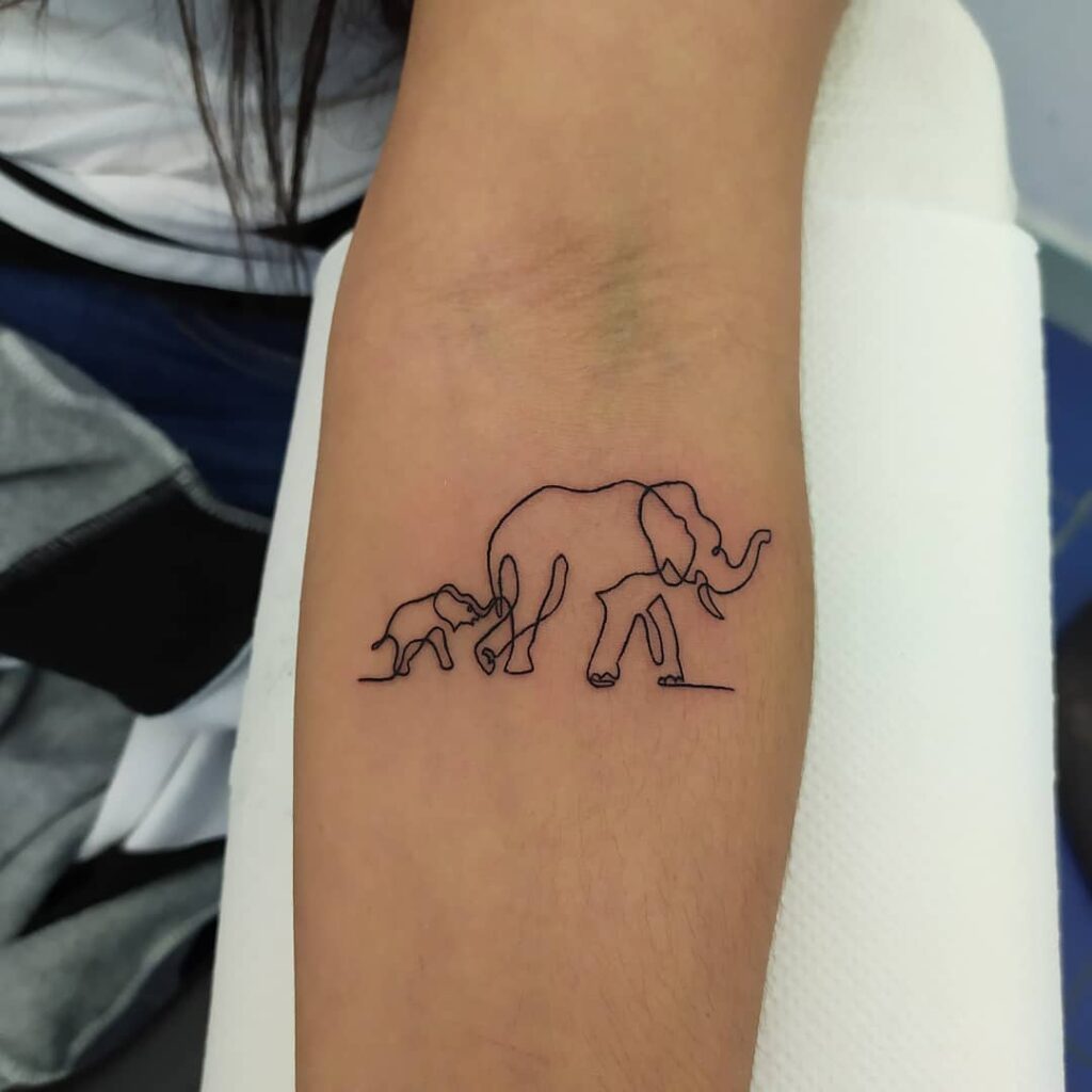 Tattoo of two elephants on the forearm for women