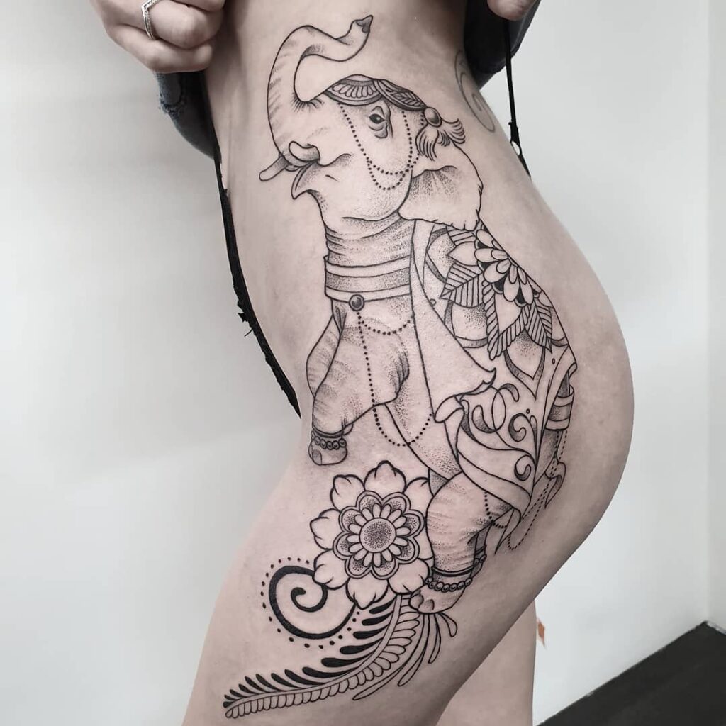 Elephant tattoo on the hip for women