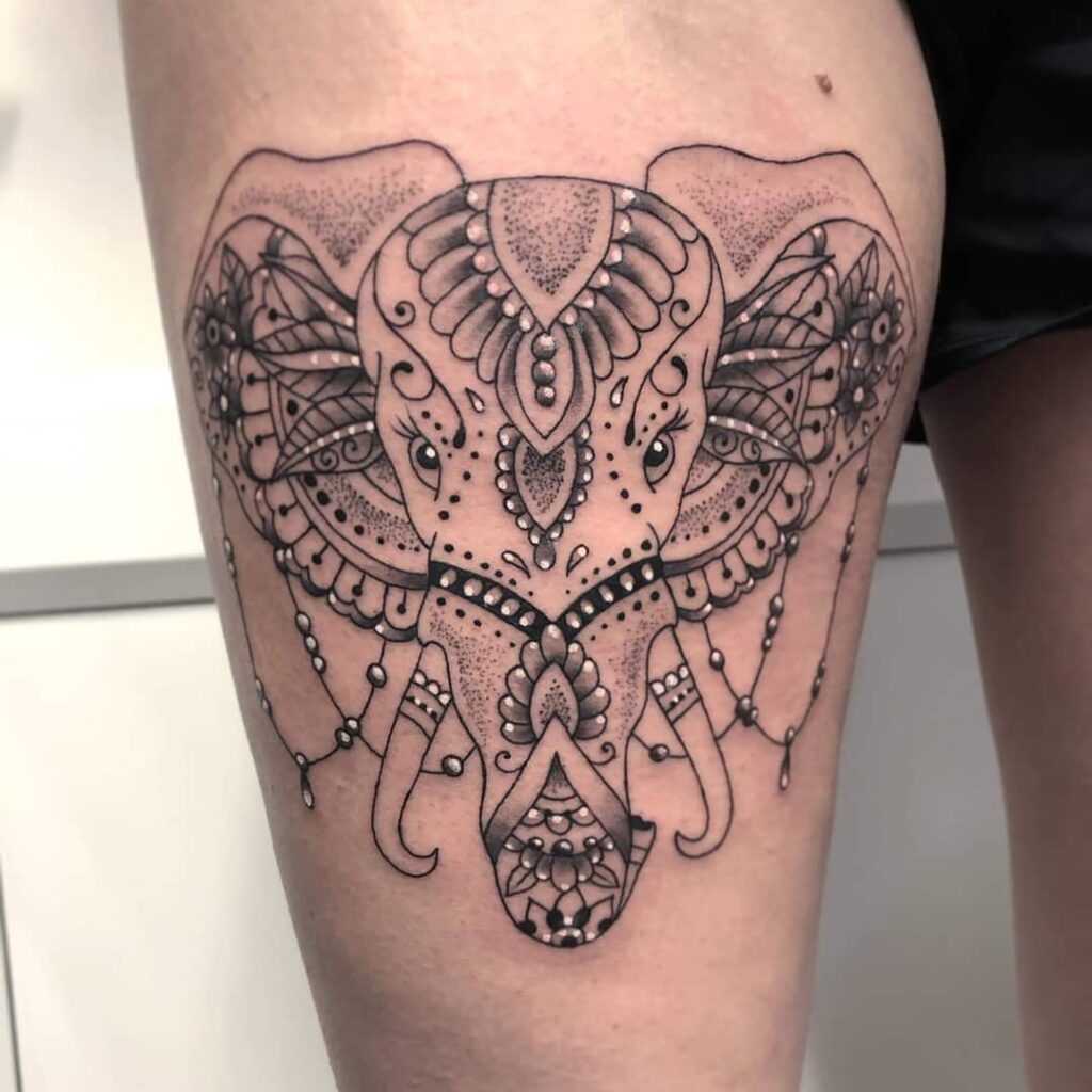 Large elephant tattoo on the thigh for women