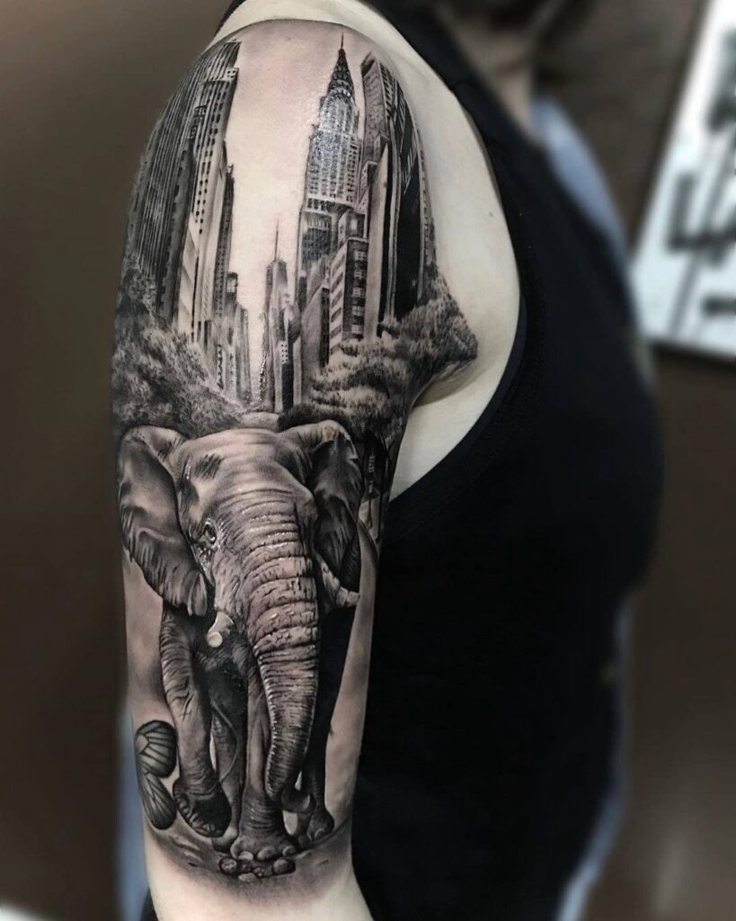 Large elephant tattoo on the shoulder for women