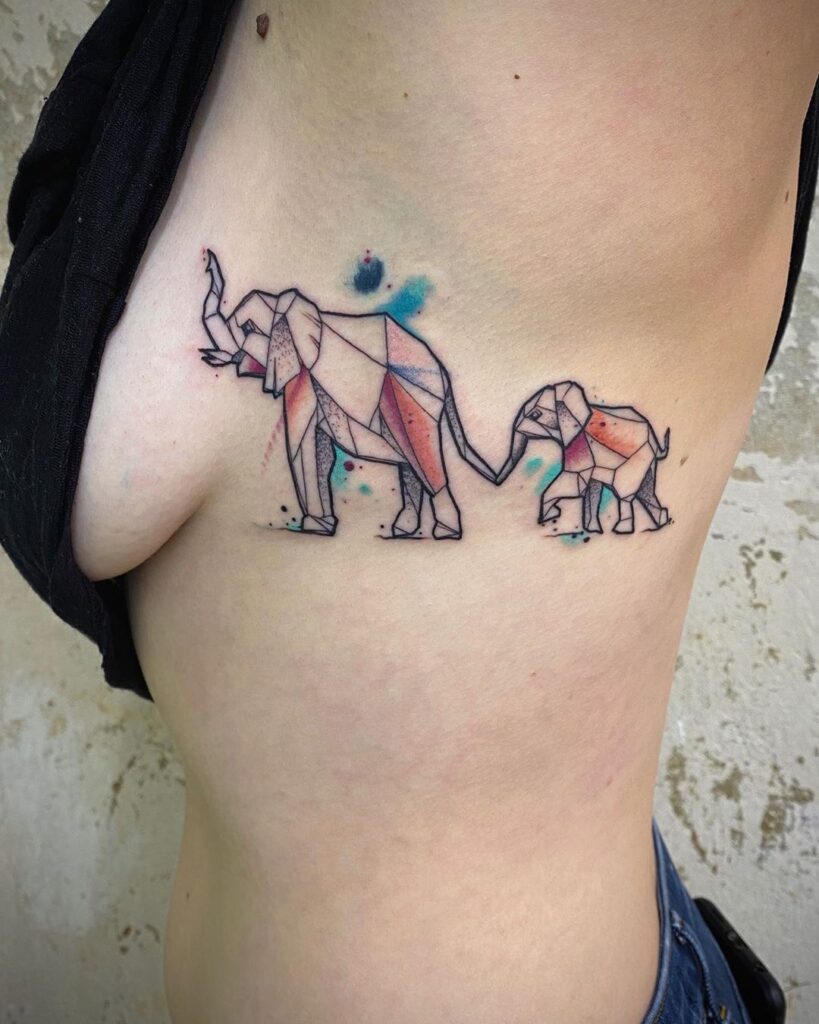 Tattoo of two elephants on the side for women